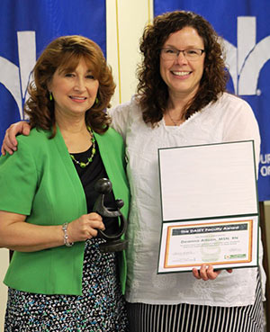 Photo of Deanna Allison accepting award